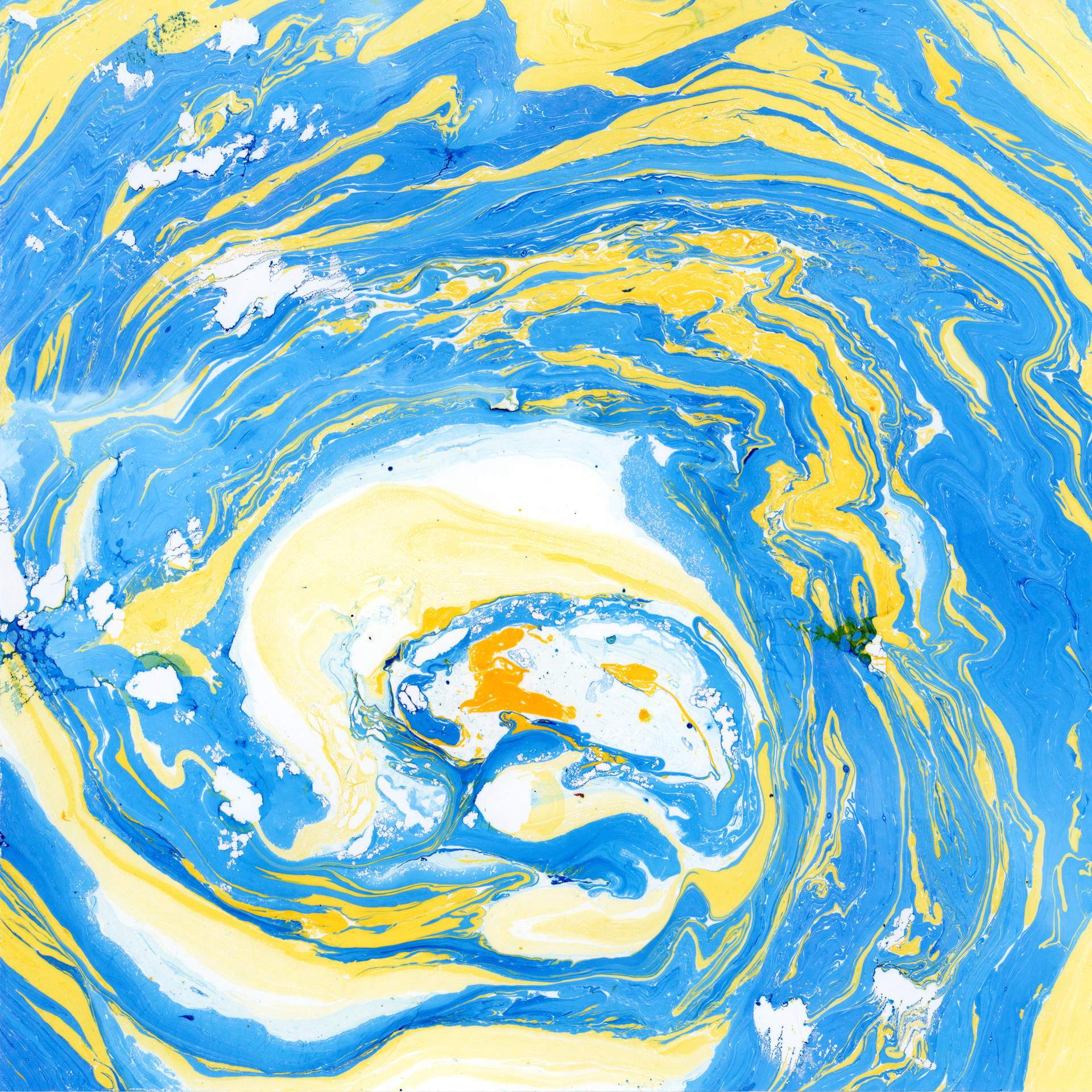 A swirl of marbled blue and yellow inks on a square sheet of watercolour paper can be seen. The swirls of colour rotate in a circular fashion towards the centre of the paper, suggesting that we are looking into the eye of a storm.