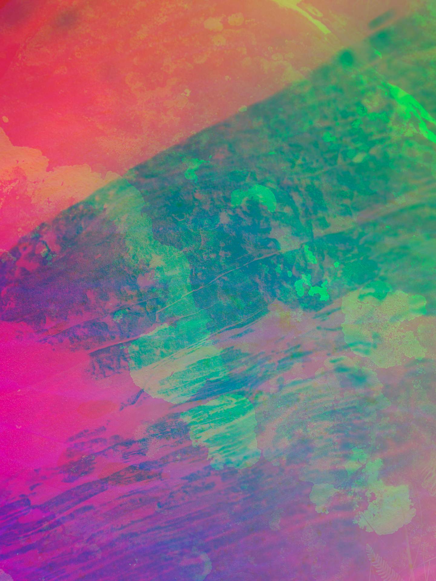 A digital collage consisting of multiple layers of photographs in an array of hyper-realistic colours. The close-up image of the surface of a rock can be seen, covered in white patches. Below this is the inverted image of what appears to be layers of rocks.