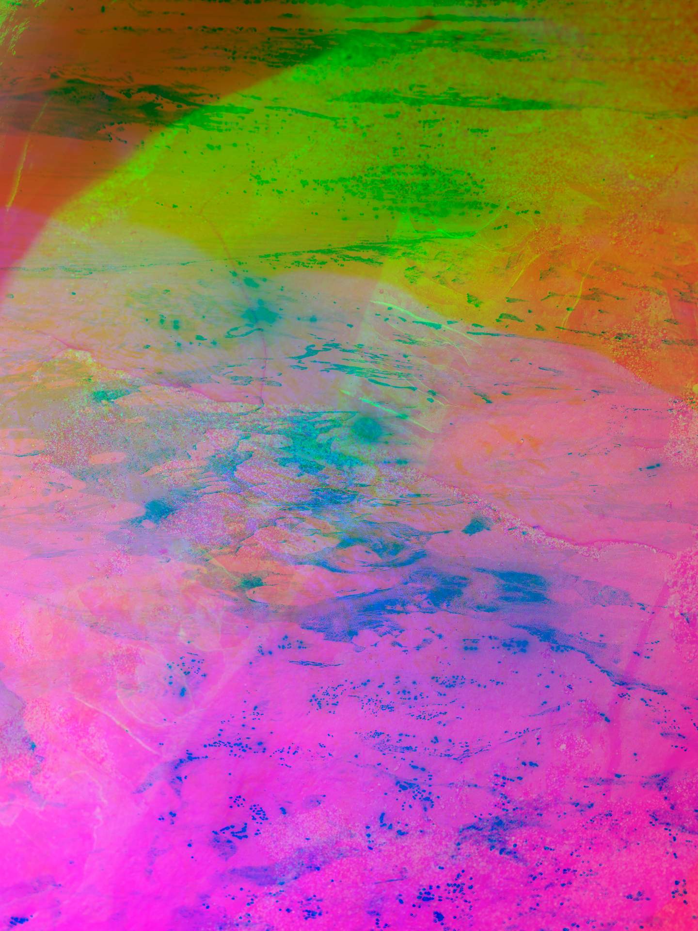A digital collage consisting of multiple layers of photographs in an array of hyper-realistic colours. A close-up image of a large rock can be seen, with what appears to be a fossil running through its centre, from top to bottom. Below this is the inverted image of the surface of a beach.