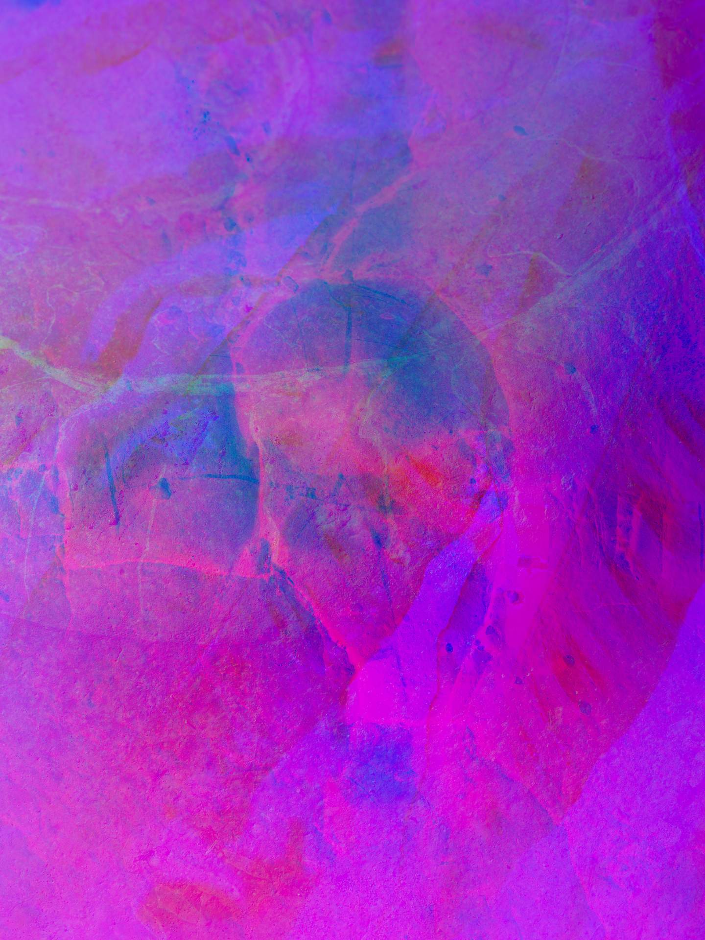 A digital collage consisting of multiple layers of photographs in an array of hyper-realistic colours. Multiple close-up images of rocks are layered on top of each other.