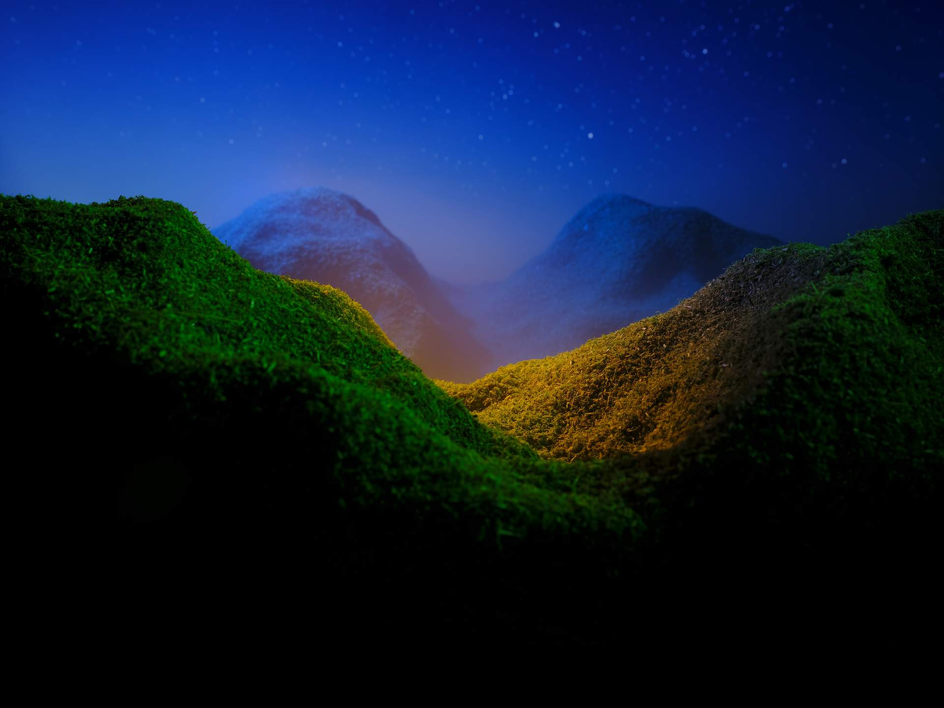 An image peering over a mountain to look at two mountains in the distance. The foreground is green, while the distant mountains are blue. The central focus of the image is a patch of land on the nearest mountain, highlighted in yellow light.